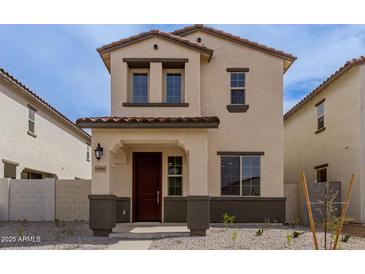 Two-story home boasts a private entrance, tile roof, and fresh xeriscaping for low maintenance at 15598 S 181St Dr, Goodyear, AZ 85338