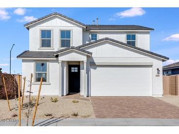 Two-story home featuring a front-entry garage and neutral-toned exterior at 25194 N 172Nd Ln, Surprise, AZ 85387