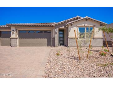 Charming single-story home with a desert-landscaped front yard and a two-car garage, perfect for modern living at 12326 W Marguerite Ave, Avondale, AZ 85323