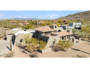 Luxury home with Spanish-style architecture, nestled in a scenic desert landscape at 7628 E Mary Sharon Dr, Scottsdale, AZ 85266