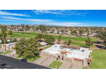 Beautiful aerial view of a golf course community with well-maintained landscaping and single Gathering homes at 10224 E Michigan Ave, Sun Lakes, AZ 85248