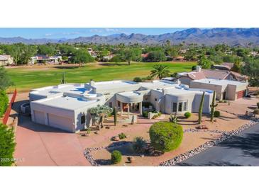 Luxury home with unique architecture, nestled in a golf course community with mountain views at 18830 E White Wing Dr, Rio Verde, AZ 85263