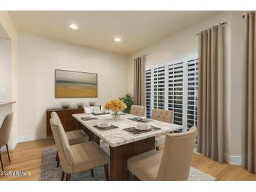 Elegant dining room with a large table and neutral decor at 21320 N 56Th St # 2159, Phoenix, AZ 85054