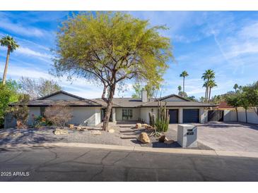 Stunning single-story home with modern design and desert landscaping at 5919 N 45Th St, Phoenix, AZ 85018