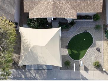 Bird's eye view of a home with a putting green, covered parking, and desert landscaping at 4121 W Medlock Dr, Phoenix, AZ 85019