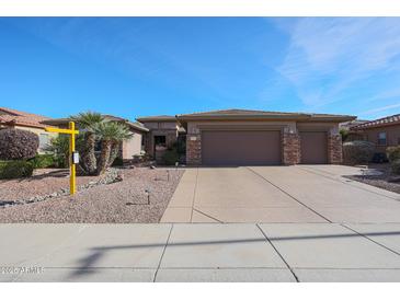 One-story home with three-car garage and desert landscaping at 19403 N Ponderosa Ct, Surprise, AZ 85387