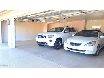 Spacious two-car garage with ample space for parking and storage at 8053 E Natal Ave, Mesa, AZ 85209