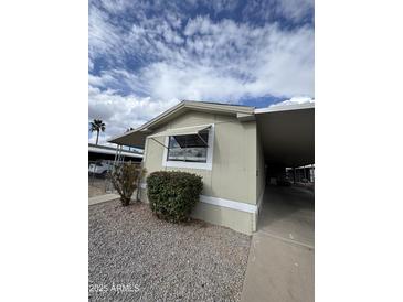 Charming single-Gathering home featuring desert landscaping, covered parking, and a cozy exterior at 245 S 56Th St # 209, Mesa, AZ 85206