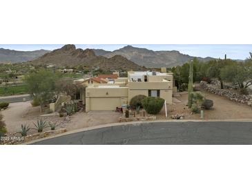 Single-story desert home with a two car garage with mature landscaping and mountain views at 6159 S Avenida Del Sol --, Gold Canyon, AZ 85118