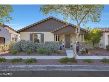 Charming single-story home featuring well-manicured landscaping and a welcoming front porch at 2342 N Delaney Dr, Buckeye, AZ 85396