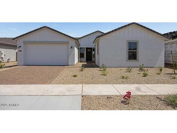 Charming one-story home with neutral exterior, well-kept landscape, and paved driveway at 25137 N 171St Ave, Surprise, AZ 85387