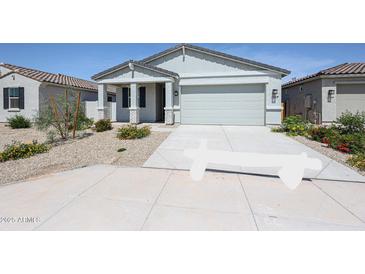 Charming single-story home featuring a well-manicured front yard and inviting entrance at 40010 W Bravo Dr, Maricopa, AZ 85138
