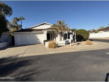 Charming single-story home with a well-manicured yard and a two-car garage in a quiet neighborhood at 402 W Grandview Rd, Phoenix, AZ 85023