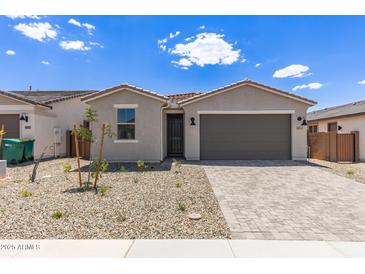 Beautiful single-story home featuring a paver driveway, low maintenance yard, and neutral color palette at 18525 E Dario Rd, Gold Canyon, AZ 85118