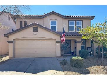 Charming two-story home with a two car garage, beautiful landscaping, and a welcoming front porch at 8953 E Yucca St, Scottsdale, AZ 85260