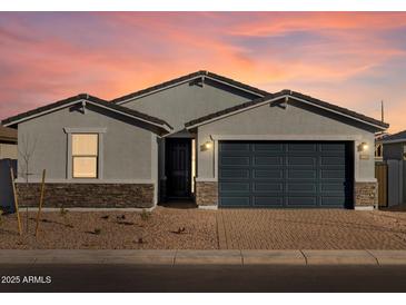 Single-story home with gray exterior, dark garage door, and stone accents at 4314 W Josephine St, San Tan Valley, AZ 85144