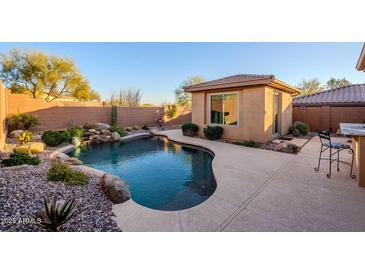 Inviting pool with spacious patio, landscaped surrounds, and casita at 41515 N Chase Oaks Way, Anthem, AZ 85086