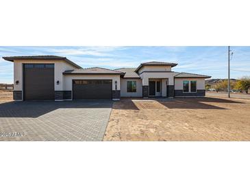 Beautiful single-story home with a three-car garage and neutral color palette at 3295 W Mesquite St, Phoenix, AZ 85086