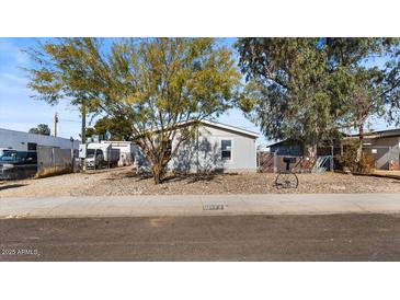 Single-story home with gray exterior and a small front yard at 2612 E Sandra Ter, Phoenix, AZ 85032