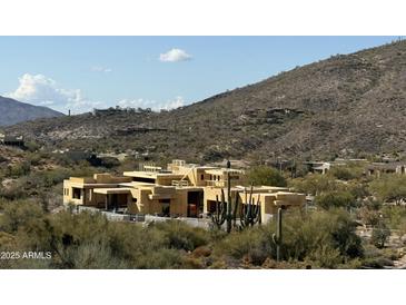 Aerial view of a large house under construction in a desert setting at 10023 E Filaree Ln, Scottsdale, AZ 85262