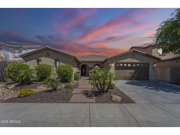 Charming single-story home with desert landscaping, brick walkway, and attached two-car garage at 3414 E Virgil Dr, Gilbert, AZ 85298