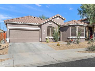 Charming single-story home with a two-car garage and well-maintained desert landscaping at 2412 W Crimson Ter, Phoenix, AZ 85085