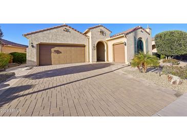 Spacious driveway leading to garages, providing ample parking and enhancing the home's curb appeal at 27478 W Tonopah Dr, Buckeye, AZ 85396