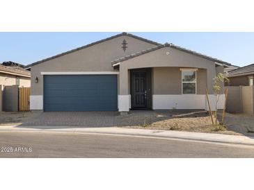 One-story home with a two-car garage and desert landscaping at 4033 S 177Th Ave, Goodyear, AZ 85338