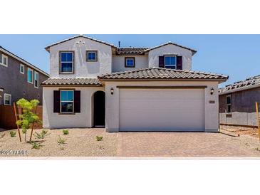 Charming two-story home with a two car garage and beautifully tiled roof at 25238 N 172Nd Ln, Surprise, AZ 85378