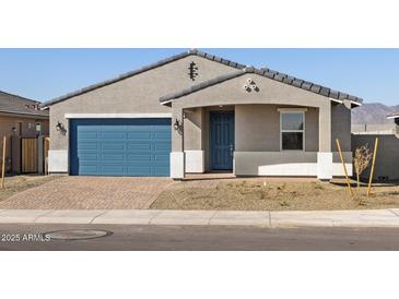 Charming single-story home with a blue garage door, gray trim and a nicely paved driveway at 4832 N 177Th Dr, Goodyear, AZ 85395