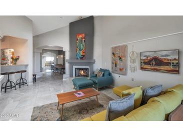 Bright living room featuring a fireplace and comfortable seating at 7777 E 2Nd St # 303, Scottsdale, AZ 85251