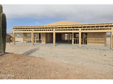 New construction home framing, showcasing desert landscape at 1907 W Brooke Ln, Queen Creek, AZ 85144