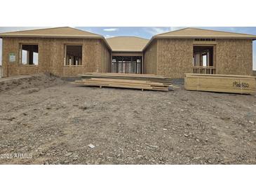 New construction home exterior, showcasing a modern design and desert landscape at 1907 W Brooke Ln, Queen Creek, AZ 85144