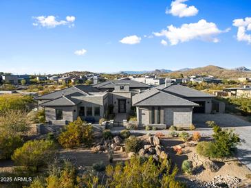 Expansive desert landscaped home features mountain views at 11946 E Cavedale Dr, Scottsdale, AZ 85262