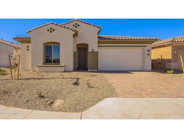 Single-story home with a two-car garage and desert landscaping at 266 S 165Th Ave, Goodyear, AZ 85338