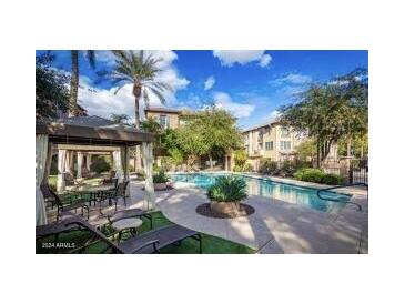 Inviting community pool with comfortable lounge chairs and shaded seating areas at 4413 N 24Th Pl, Phoenix, AZ 85016