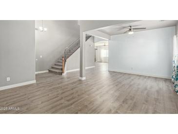 Bright living room with hardwood floors and high ceilings at 23559 W Wayland Dr, Buckeye, AZ 85326