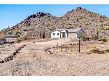 Single story home with attached garage and mountain views at 27112 N 148Th Dr, Surprise, AZ 85387