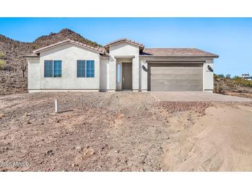 Single-story home with attached garage and desert landscaping at 27112 N 148Th Dr, Surprise, AZ 85387