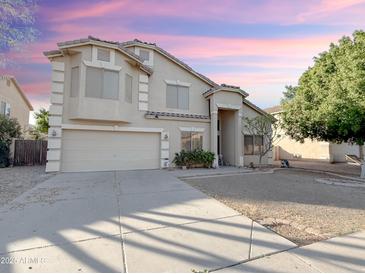 Two-story house with attached garage and landscaped yard at 1342 N Mckenna Ln, Gilbert, AZ 85233