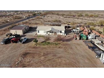 Aerial view of house, large lot, and various outbuildings at 12601 S Hermit Rd, Buckeye, AZ 85326