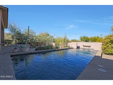 Inviting swimming pool with a water feature at 6486 E Oberlin Way, Scottsdale, AZ 85266