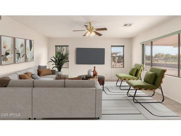 Bright living room featuring a comfy sectional sofa and large windows at 1211 E Torrey Pines Ln, Chandler, AZ 85249