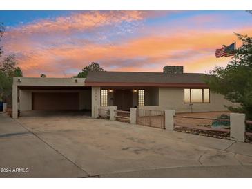 Single-story home with attached garage and desert landscaping at 2546 E Hale St, Mesa, AZ 85213