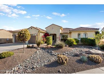 Single-story home with desert landscaping and two-car garage at 20103 N 265Th Ave, Buckeye, AZ 85396