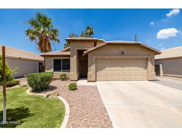 Charming single-Gathering home featuring a well-manicured front yard and a two-car garage at 1778 S Saddle St, Gilbert, AZ 85233
