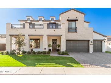 Two-story home with light stone exterior, balcony, and landscaped lawn at 3901 E Sagebrush St, Gilbert, AZ 85296