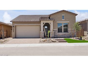 Charming single-Gathering home featuring desert landscaping, a two-car garage, and a welcoming entrance at 32962 N 131St Dr, Peoria, AZ 85383