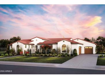 Stunning Spanish-style home with red tile roof, landscaping, and a 2-car garage at 6621 E Doubletree Ranch Rd, Paradise Valley, AZ 85253