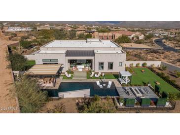 Aerial view of a luxurious home with a pool and expansive backyard at 17213 E Morning Vista Ct, Rio Verde, AZ 85263